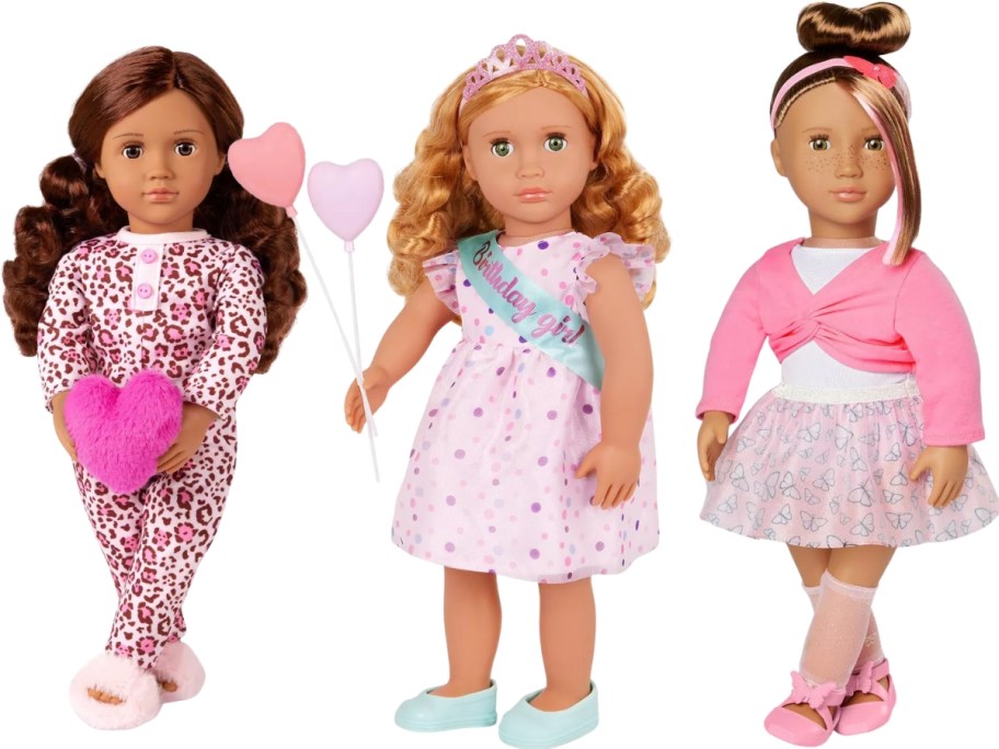 a doll with leopard print pajamas, a doll with a dress and birthday sash and balloons, and a doll in a ballerina outfit