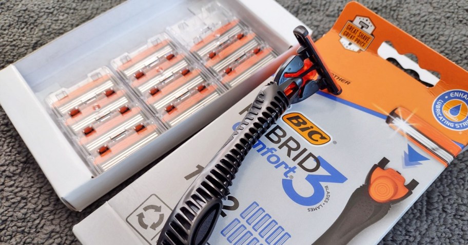 razor on top of it's box with refill cartridges in background