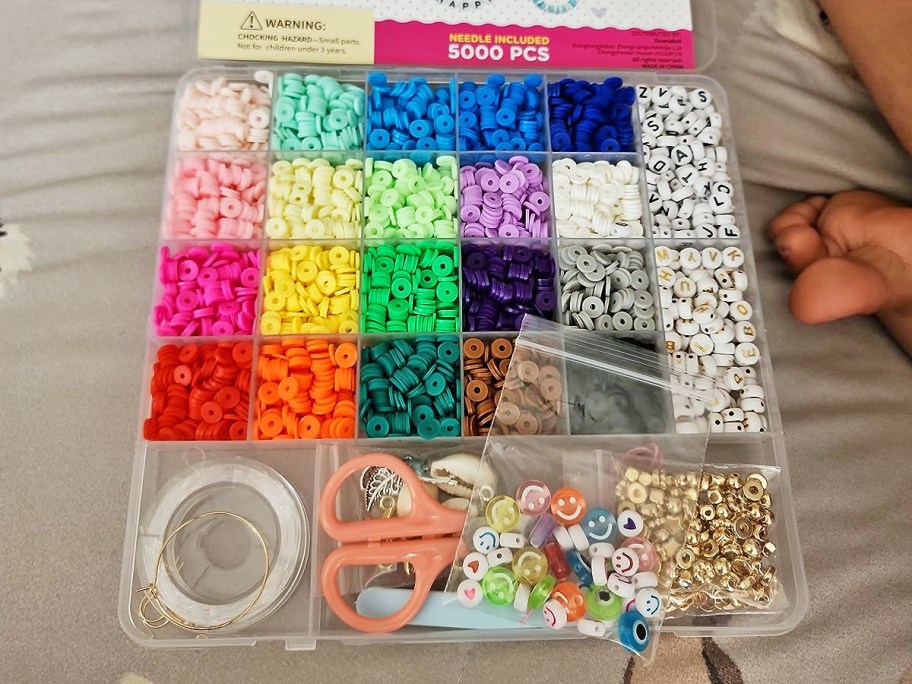 Bracelet making kits with various colors of beads, charms and accessories