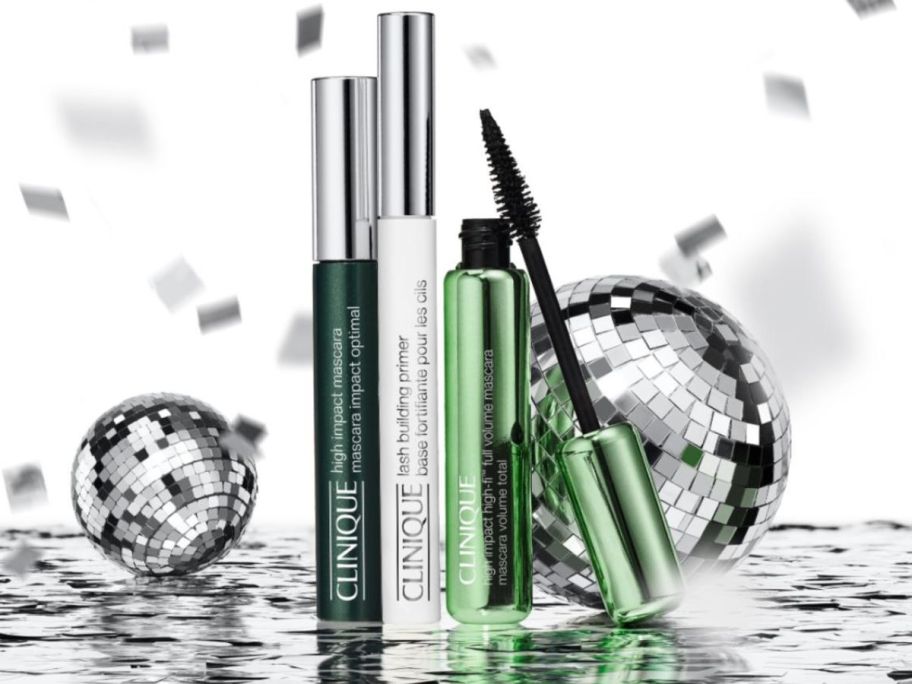 3 Clinique Mascara surrounded by confetti and mini disco balls