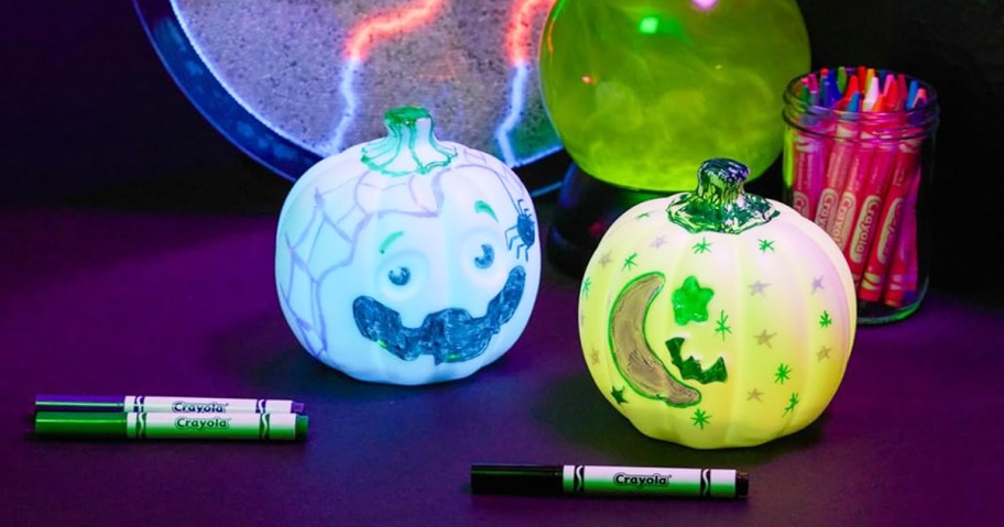 light up pumpkin toys with doodles all over them