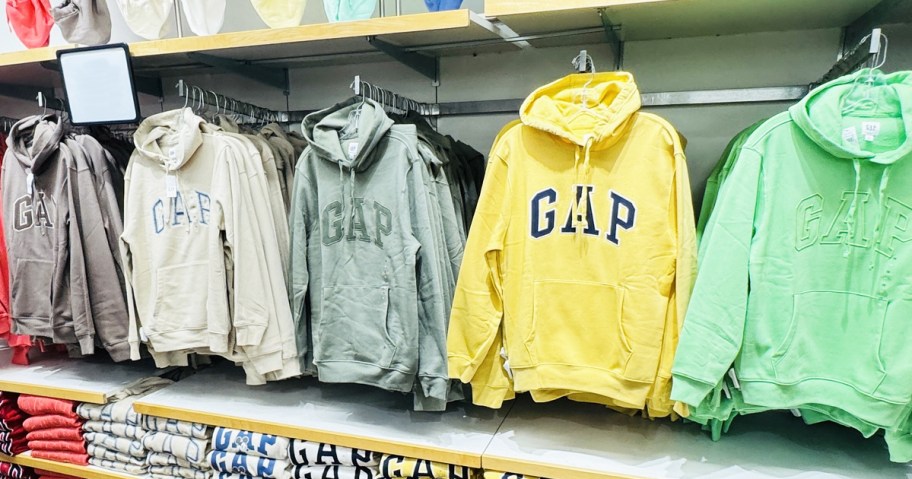 row of colorful gap sweatshirts in store
