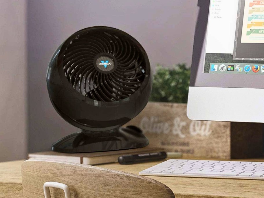 a small black fan on a desk