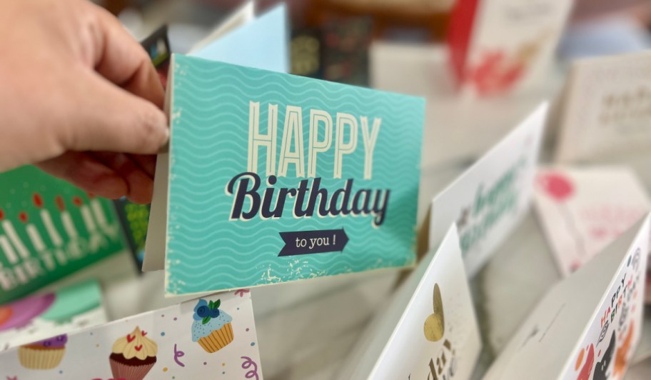 different happy birthday cards displayed on countertop