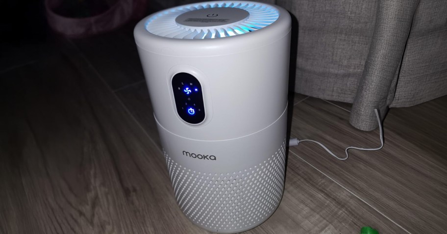 MOOKA Air Purifier being used on the floor of a living room