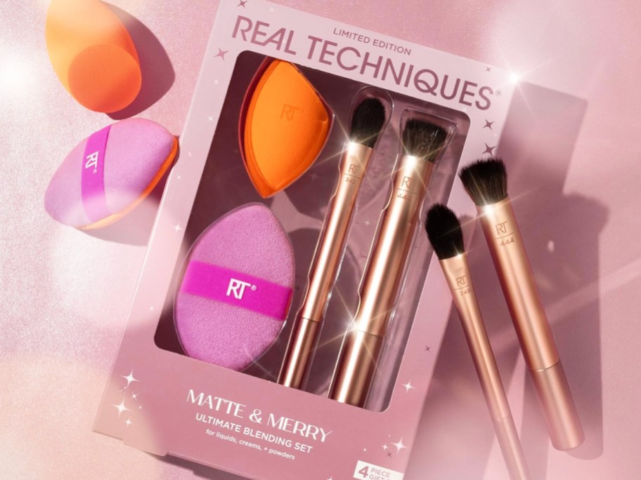 Real Techniques makeup brush set with brushes and sponges around it
