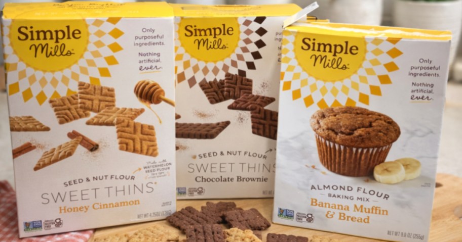 Three different boxes of simple Mills cookies, and bread mix on kitchen counter
