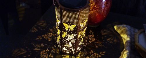A butterfly solar lantern glowing in the dark