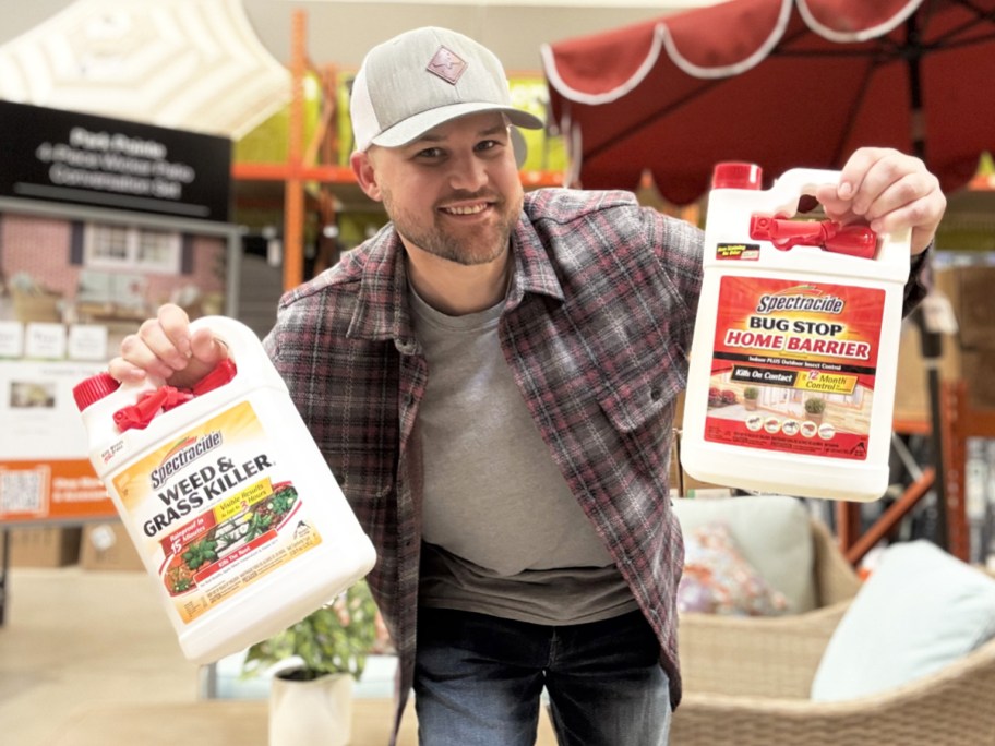 hand holding up bottles of Spectracide wed killer and bug stop