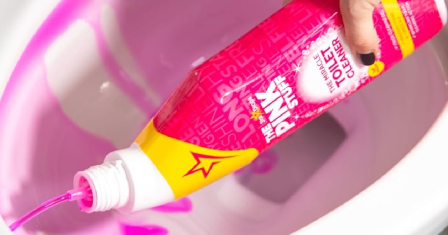 person cleaning toilet with The Pink Stuff Miracle Toilet Cleaner