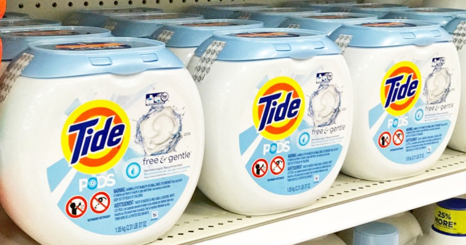 white and blue containers of Tide Pods Free & Gentle on store shelf