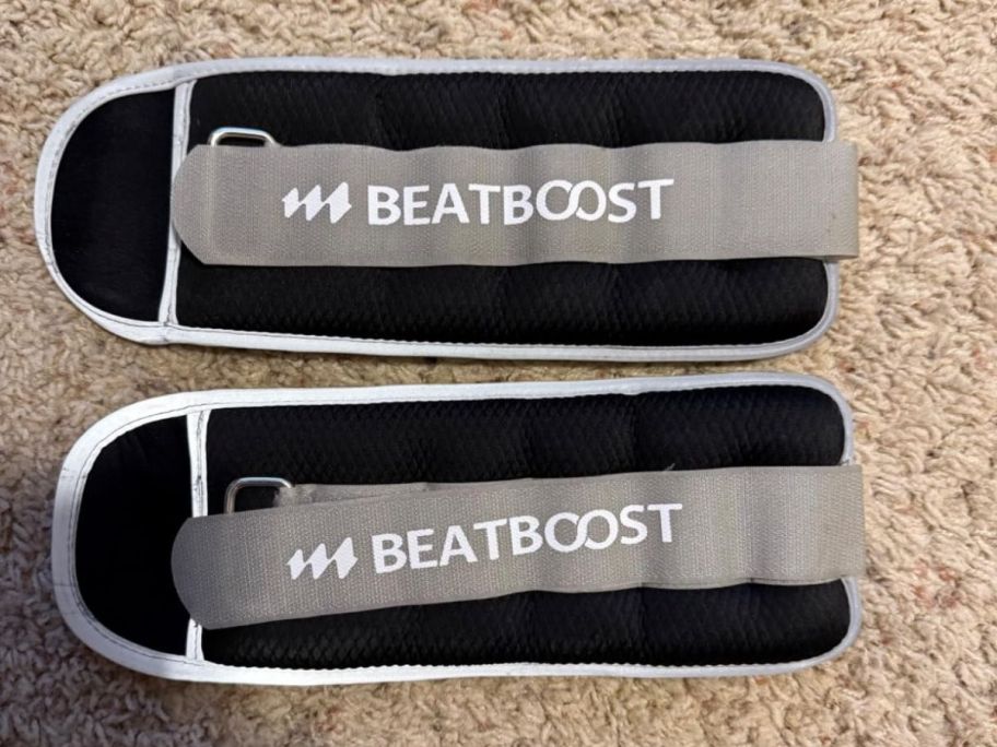 two ankle weights on floor