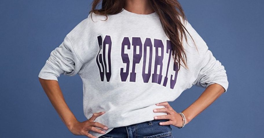 woman wearing francescas top that says go sports on it