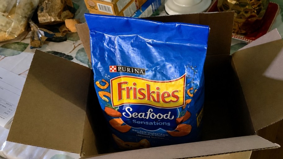 a bag of friskies seafood catfood in an amazon box