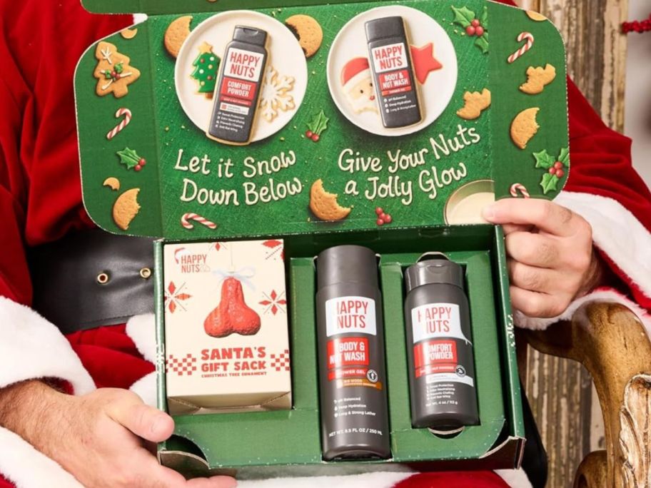 santa holding Happy Nuts Holiday Gift Bundle Kit