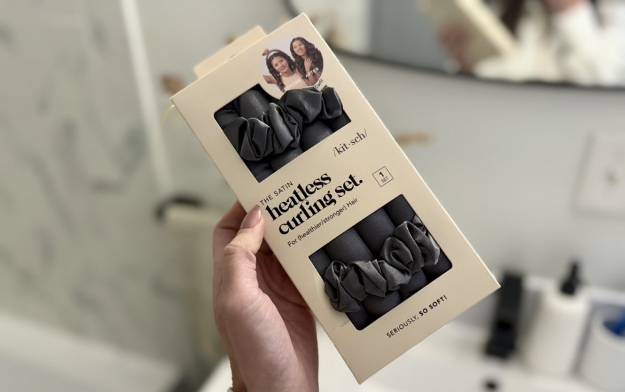 a womans hand holding a box of kitsch heatless curling set