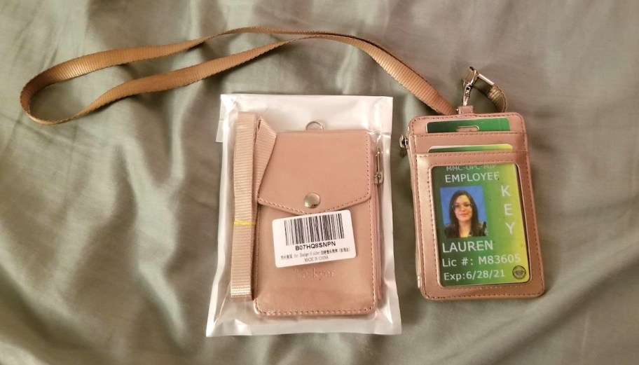 pink lanyard in bag and spread out on sheets with women id