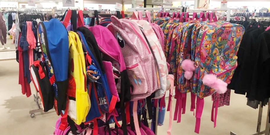 character backpacks hanging macys store 