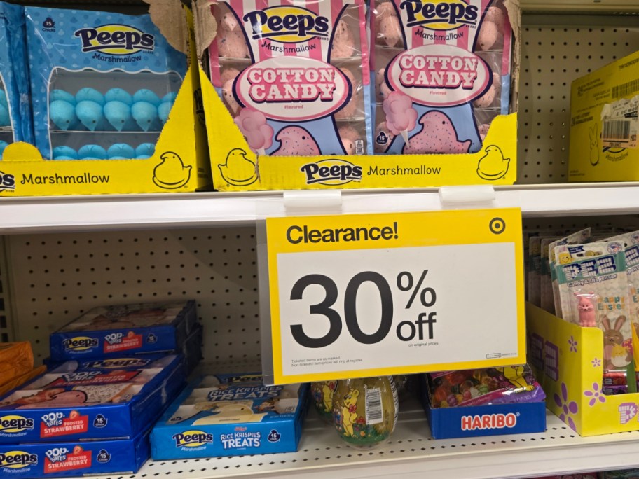 Store shelf with Peeps marshmallows, cotton candy flavor, on clearance. Bold yellow sign shows "30% off."
