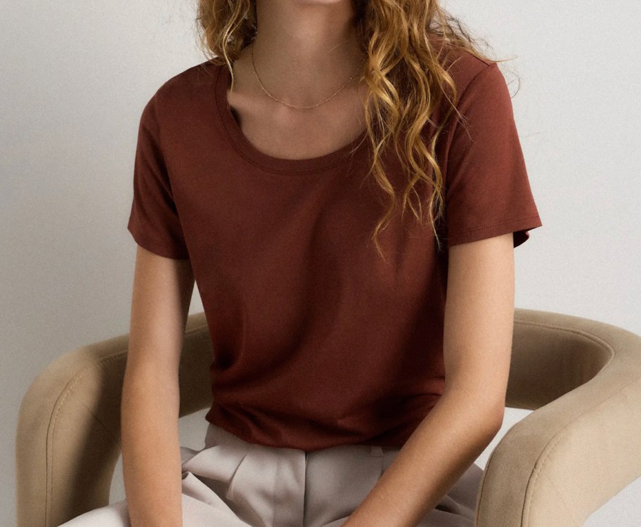 close up of woman wearing red tshirt