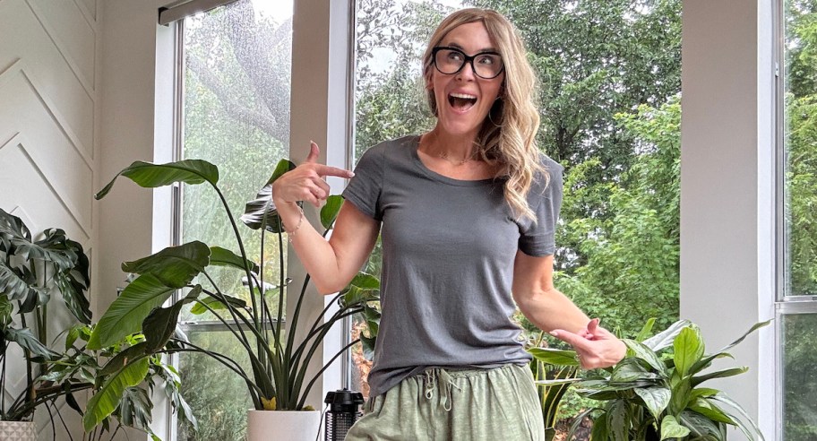 woman pointing to gray tshirt