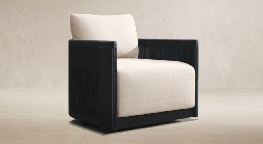 black and white rope chair with white cushions