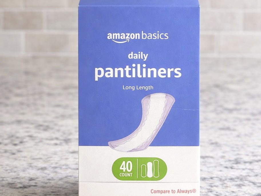 box of Amazon Basics Pantiliners on counter