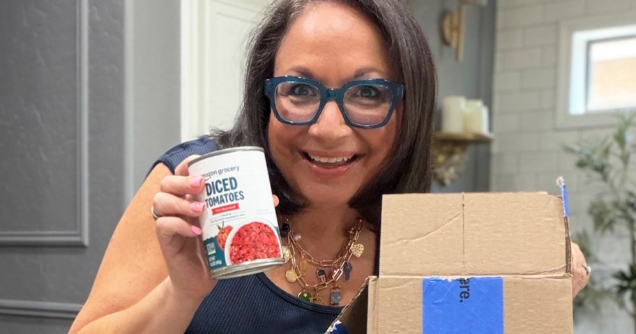 woman holding up a can of Amazon Grocery Diced Tomatoes
