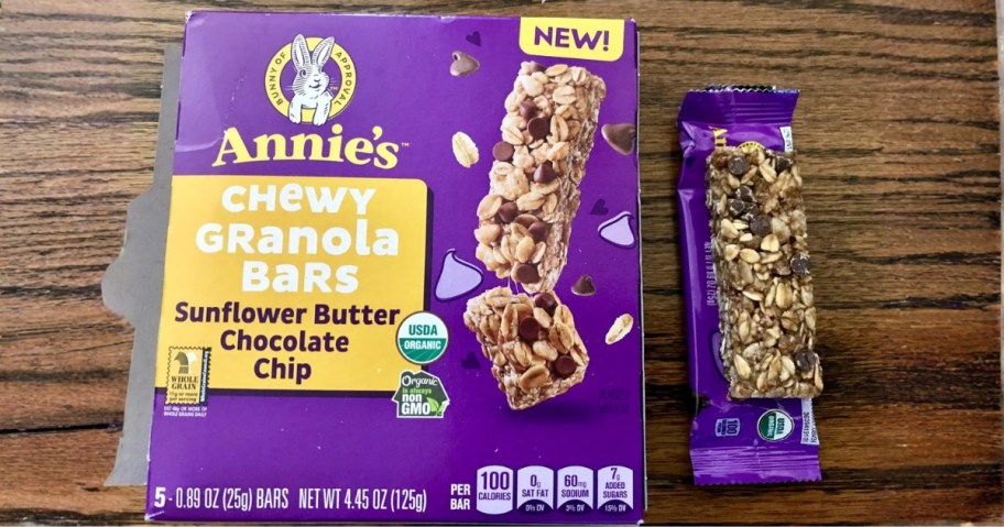 annie's chewy sunflower butter chocolate chip granola bar box with bar sitting on packaging
