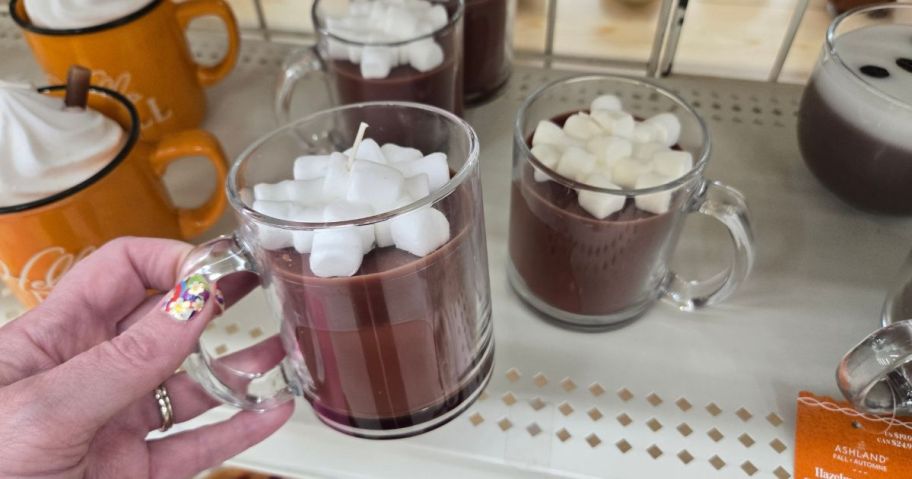 candles that look like mugs of hot cocoa with a dollop of whipped cream on them