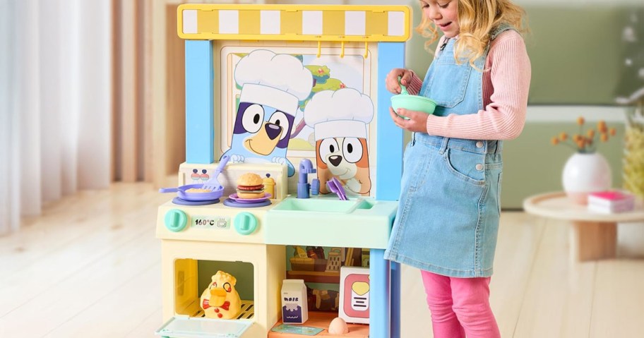 girl playing with the Bluey Kitchen Playset