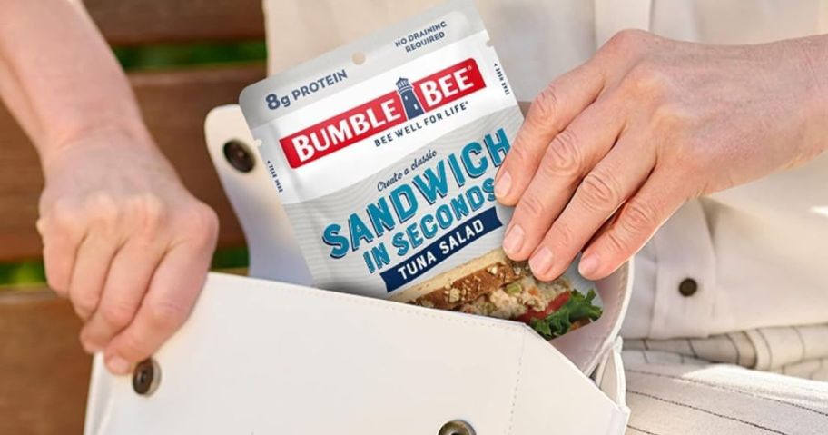 Woman pulling a Bumble Bee Tuna Pouch out of a purse