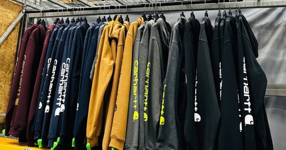 rack of Carhartt hoodies in store