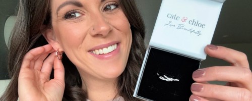 woman shoring off Cate & Chloe Lauren 18k White Gold Plated Twisted Hoop Earrings