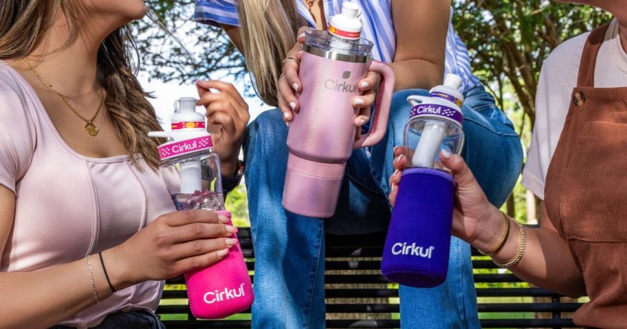 3 women holding cirkul water bottles
