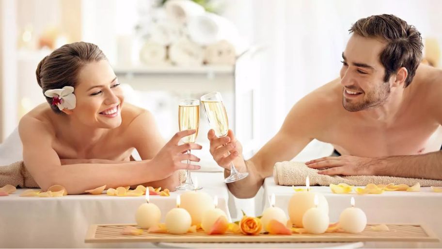 Couples massages with drinks in hand