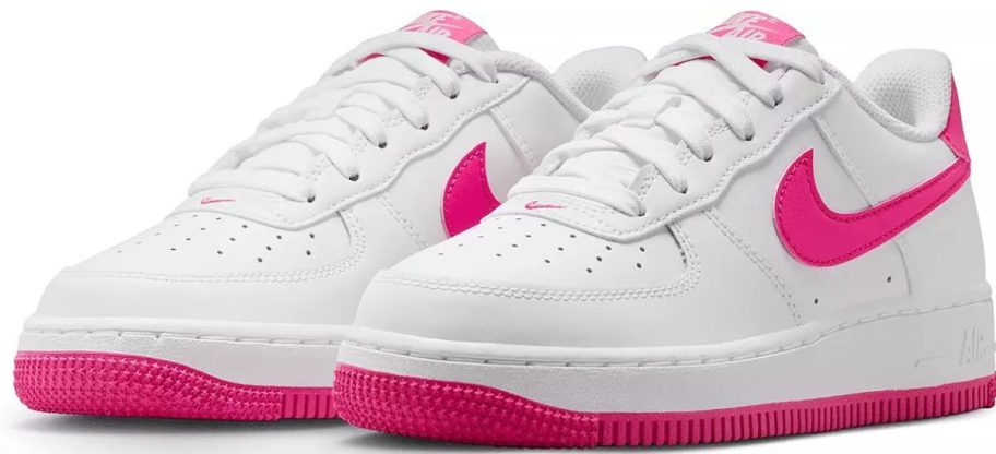 Stock image of pink and white Nike Kids Grade School Air Force 1 Shoes