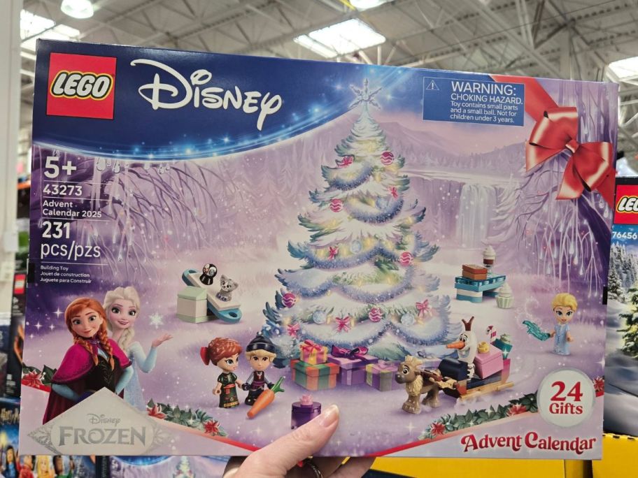 hand holding Disney Frozen LEGO Advent Calendar box