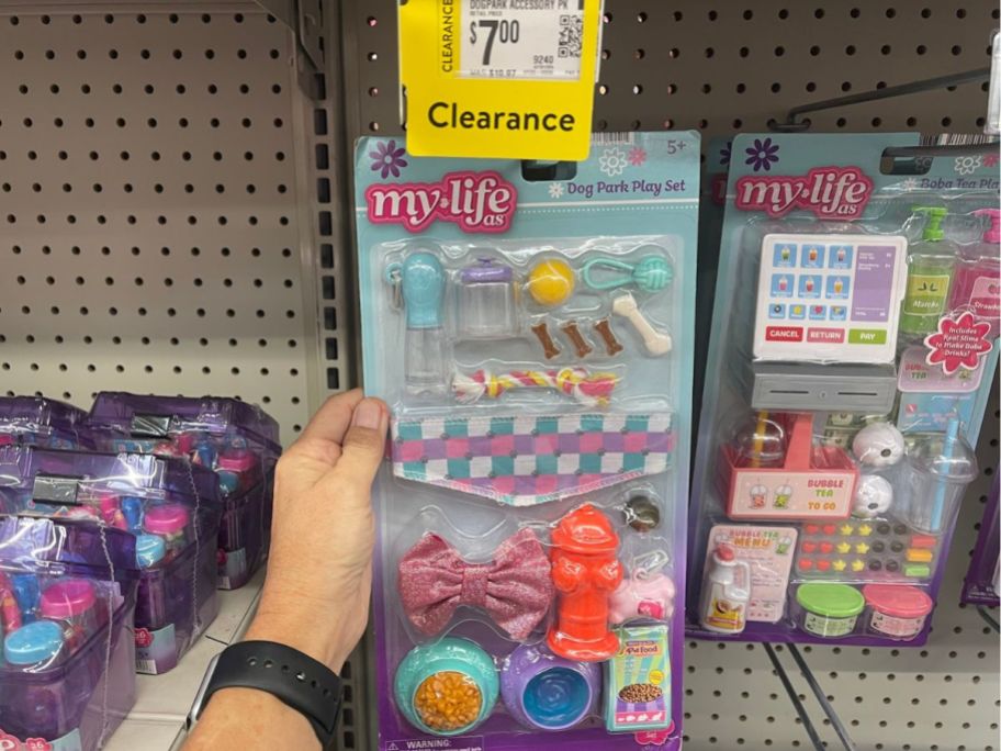 Hand holding a My Life As 17-Piece Dog Park Play Set