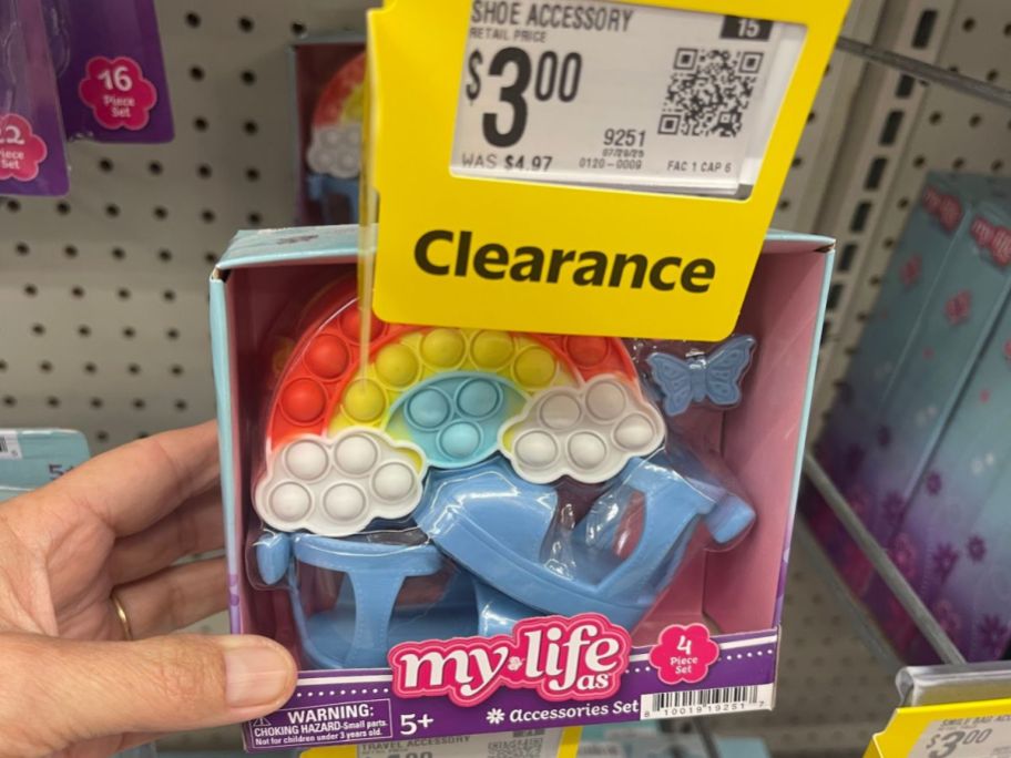 Hand holding a My Life As Pop Bag & Blue Shoes Accessories Set