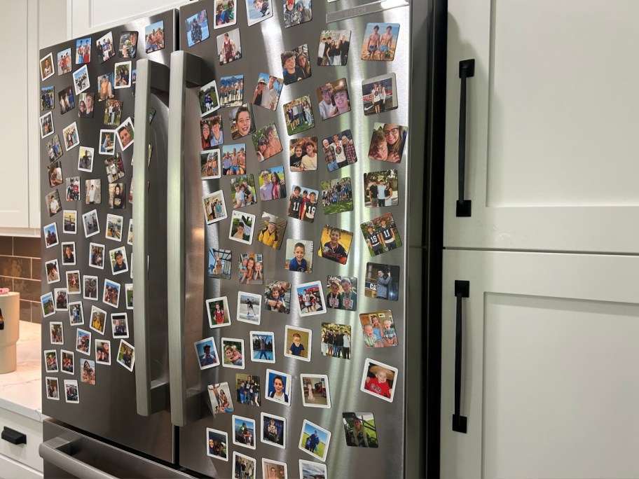 Stainless steel refrigerator covered with 2 x 2 Shutterfly magnets