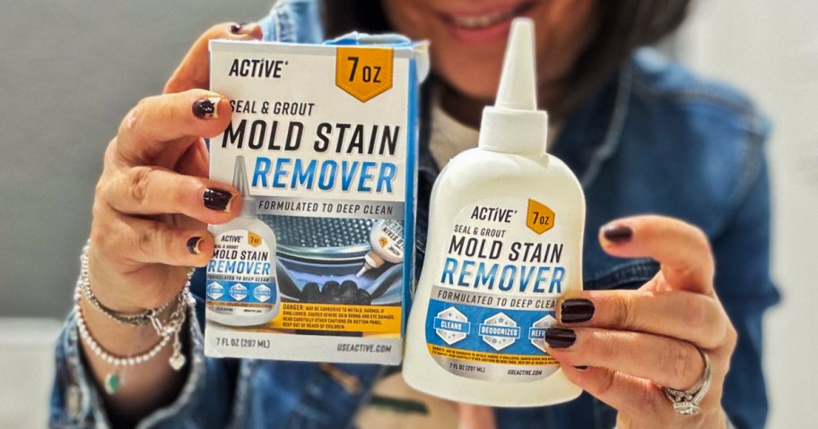 woman holding bottle and package for ACTIVE mold stain remover gel