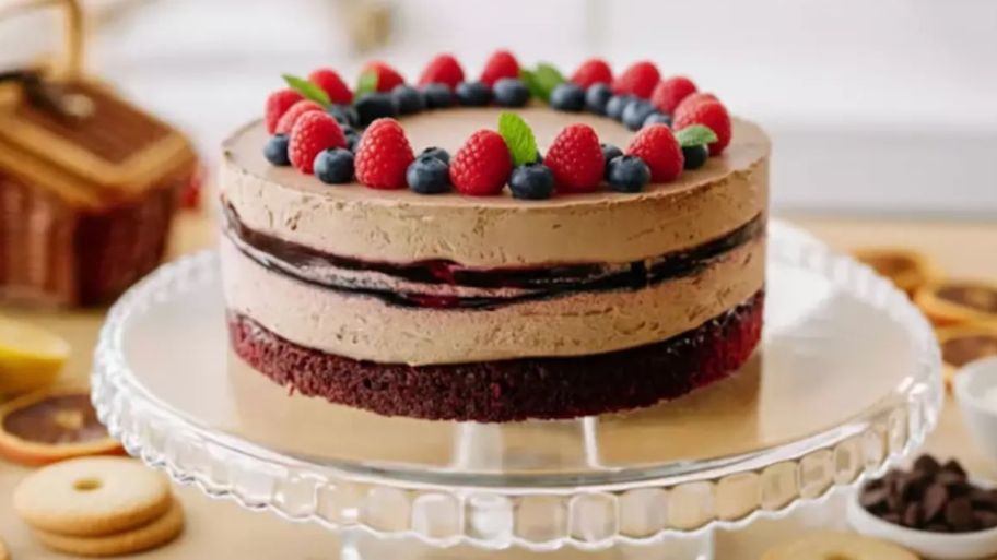 baked cake with fruit on a stand