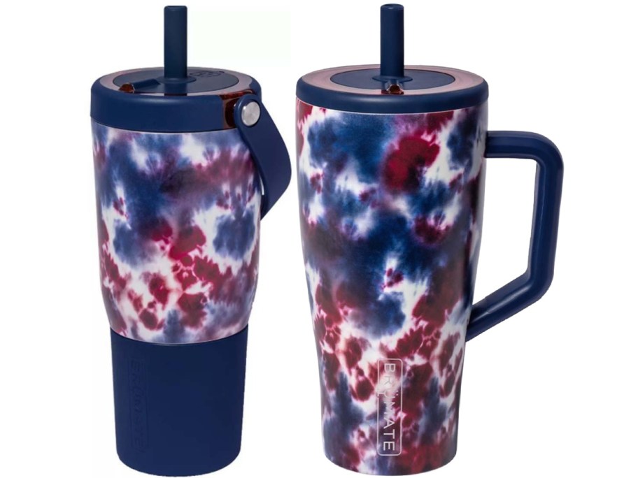 Two insulated tumblers with red, white, and blue tie-dye patterns. One has a handle and both have dark blue lids with straws.