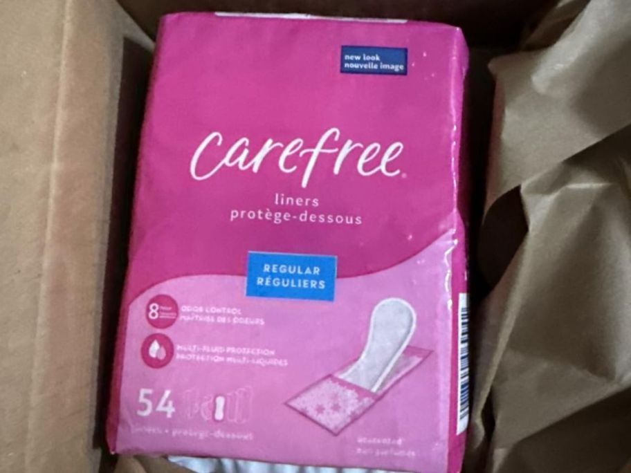 a pink carefree panty liner bag in a box