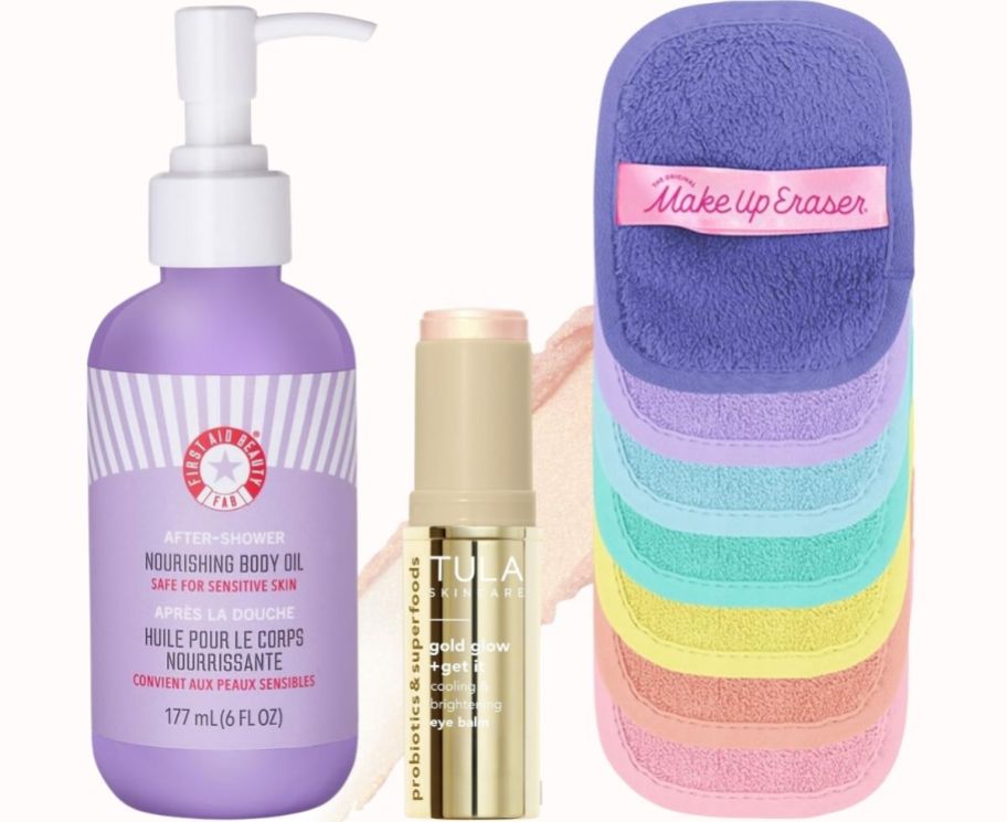 a bottle of body oil, under eye stick balm and a set of reusable makeup erasers