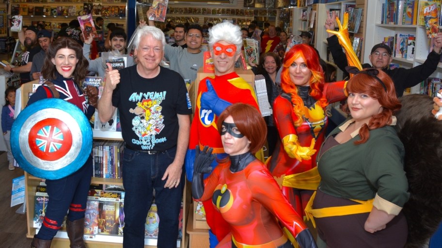 people in a comic book store celebrating free comic book day