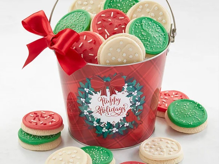 red chrismtas pail with cookies inside 