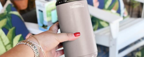 person holding a thermacell device