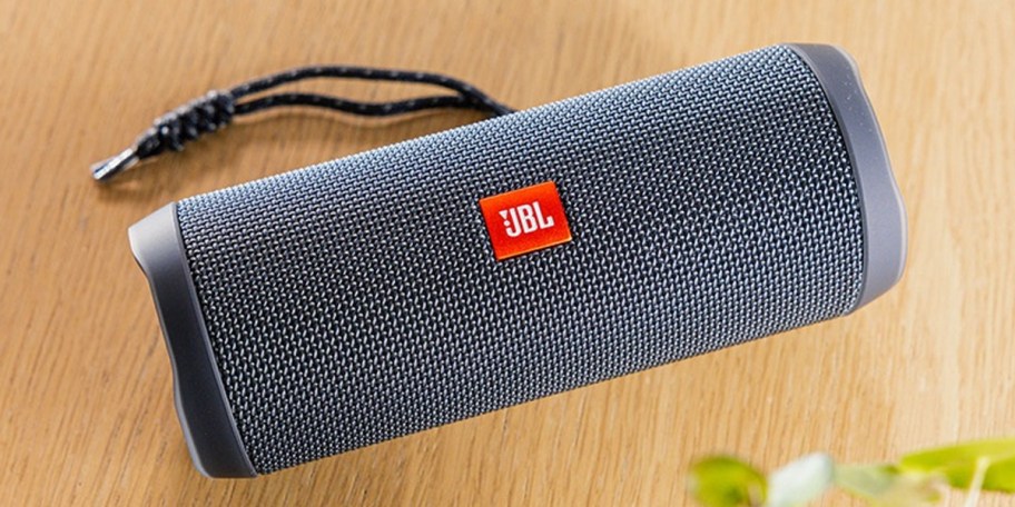 gray jbl speaker on table